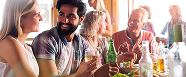 People laughing and drinking at a bar